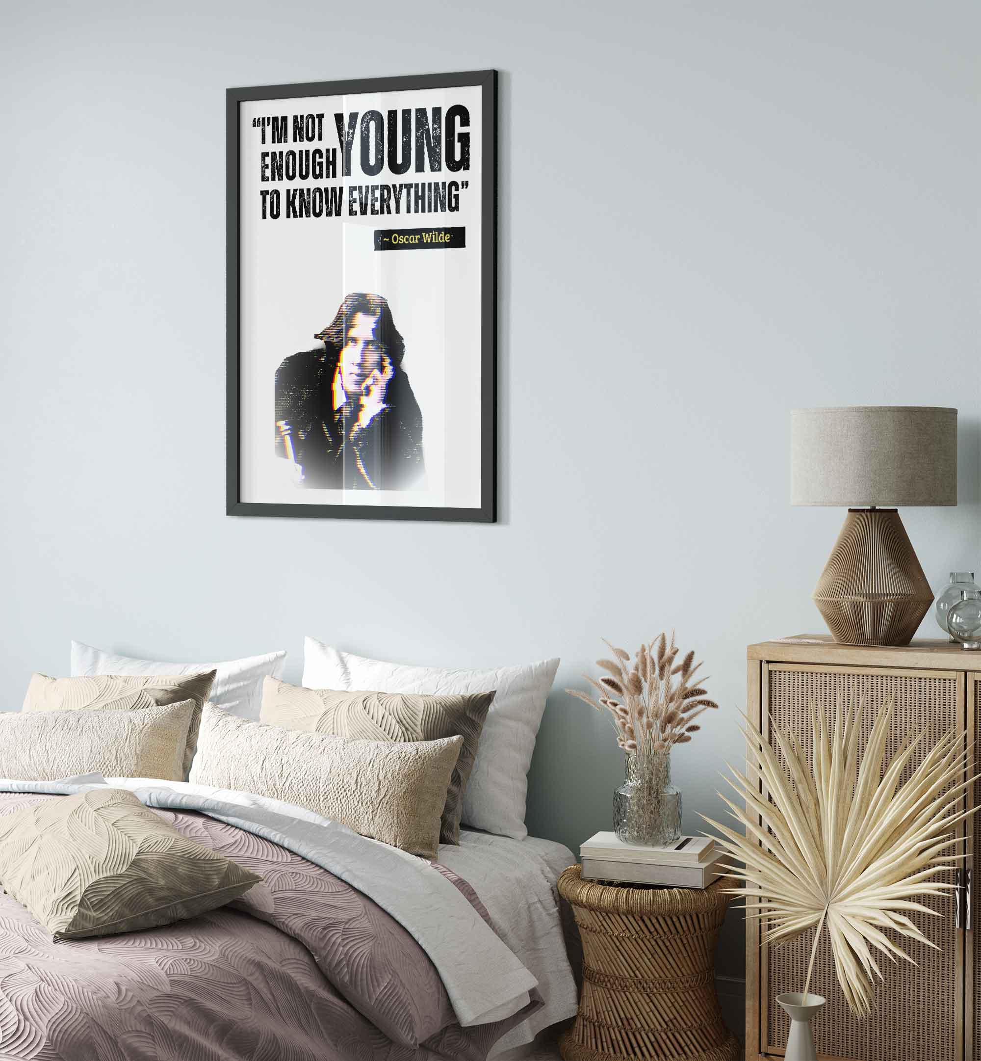 a poster hangs above a bed in a bedroom